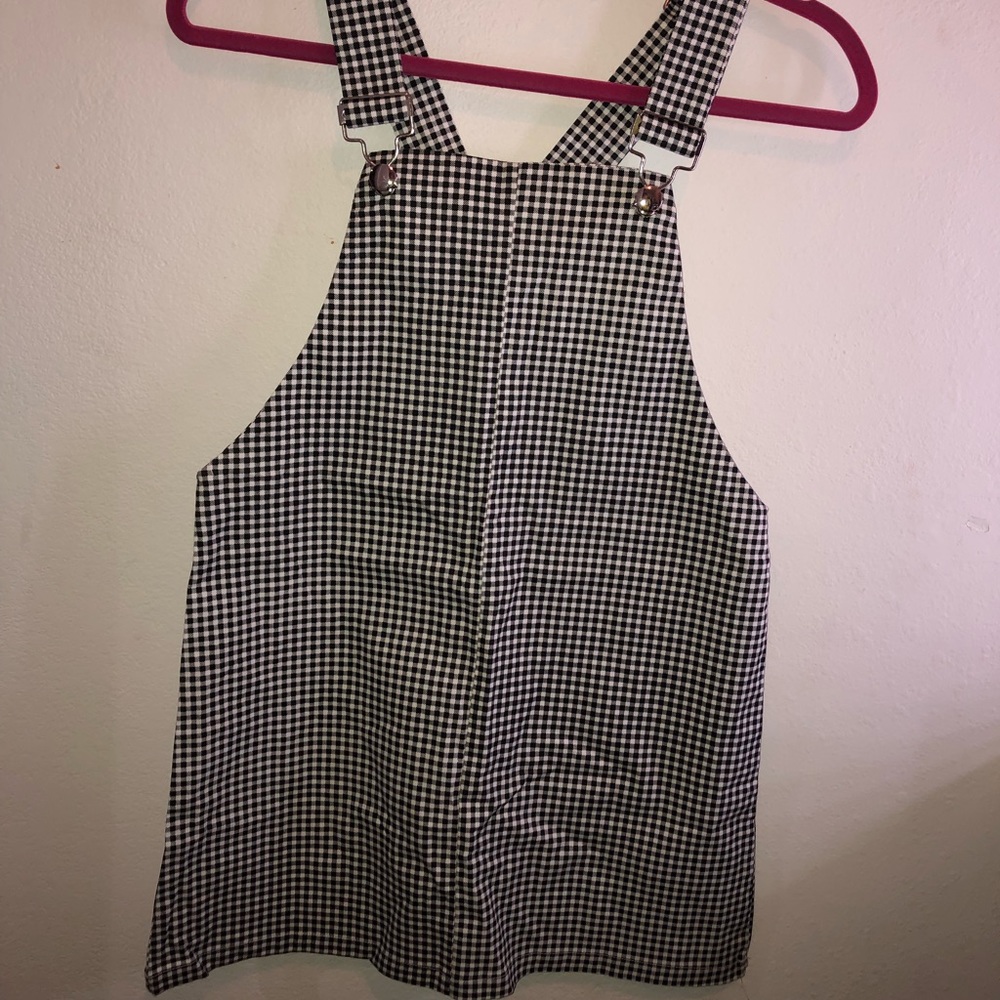 Black and white checkered overalls.